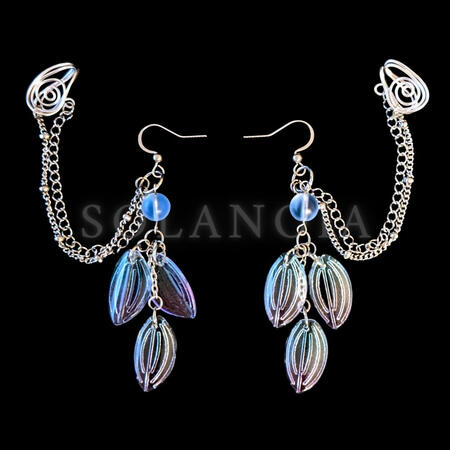 Dreamcore woodland fairy cuffed earrings 2.5 inches long 5 cm. Comfortable adjustable conch cartilage ear cuff, hypoallergenic silver colored aluminum in a swirl pattern. Cuffs connected to leaf dangle and mermaid bead by double chains with beads